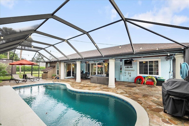 2990 SW Ventura St, Port Saint Lucie, FL 34953 - swimming pool with ceiling fan, a patio area, area for grilling, and glass enclosure