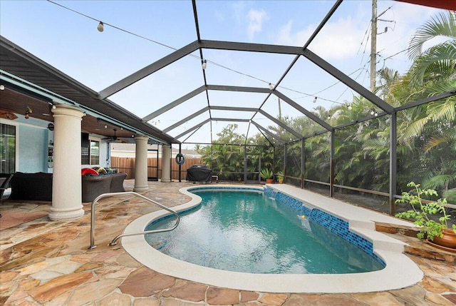 2990 SW Ventura St, Port Saint Lucie, FL 34953 - swimming pool with a patio, ceiling fan, grilling area, and glass enclosure