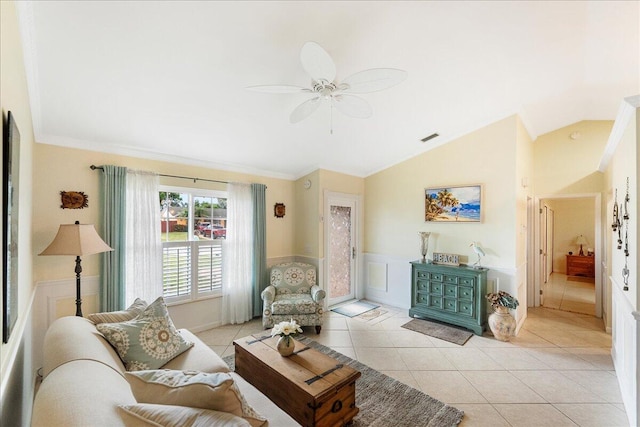 2990 SW Ventura St, Port Saint Lucie, FL 34953 - living area with vaulted ceiling, ornamental molding, a ceiling fan, a wainscoted wall, and light tile patterned flooring