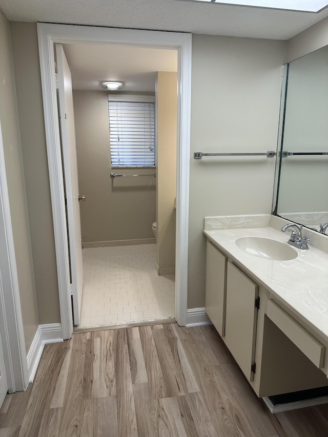 5917 Via Vermilya Unit 306, Lake Worth, FL 33462 - bathroom featuring vanity and wood finished floors