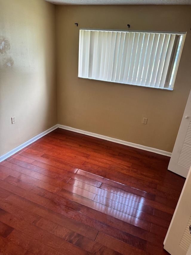 984 Lake Victoria Dr Unit B, West Palm Beach, FL 33411 - spare room with hardwood / wood-style flooring and baseboards