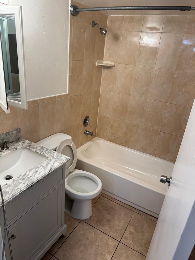 984 Lake Victoria Dr Unit B, West Palm Beach, FL 33411 - bathroom featuring  shower combination, vanity, tile patterned flooring, and tile walls