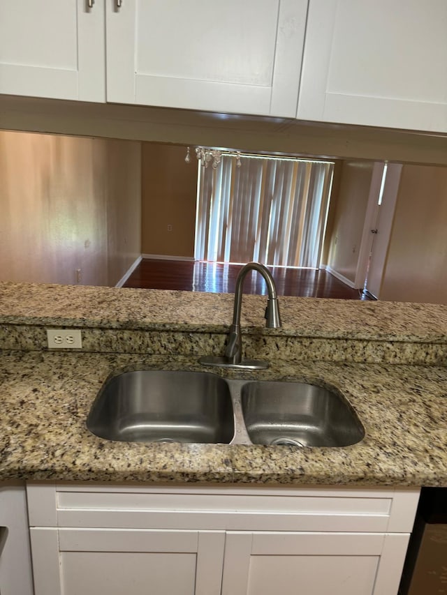 984 Lake Victoria Dr Unit B, West Palm Beach, FL 33411 - kitchen with white cabinetry, light stone countertops, and wood finished floors
