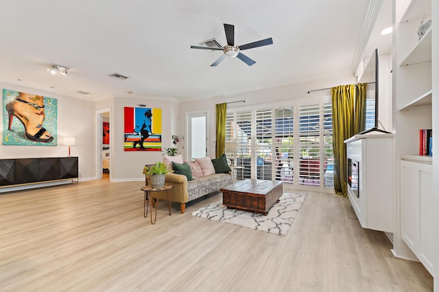 231 Caravelle Dr, Jupiter, FL 33458 - living room featuring wood finished floors, a ceiling fan, and crown molding