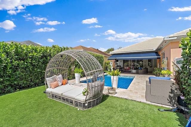 231 Caravelle Dr, Jupiter, FL 33458 - view of swimming pool with a patio, a yard, and outdoor lounge area