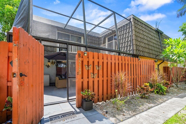 22180 Boca Rancho Dr Unit B, Boca Raton, FL 33428 - view of side of property featuring glass enclosure and mansard roof