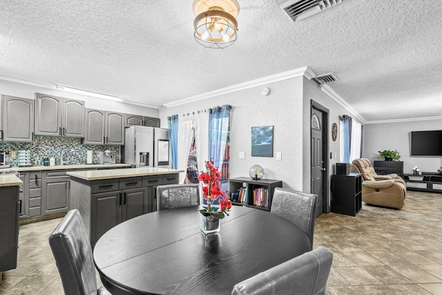 22180 Boca Rancho Dr Unit B, Boca Raton, FL 33428 - dining room featuring crown molding, a textured ceiling, and a textured wall
