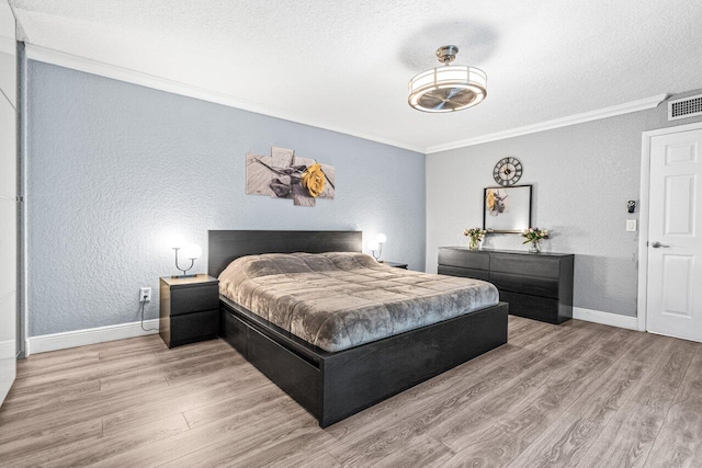 22180 Boca Rancho Dr Unit B, Boca Raton, FL 33428 - bedroom with a textured wall, crown molding, a textured ceiling, and wood finished floors