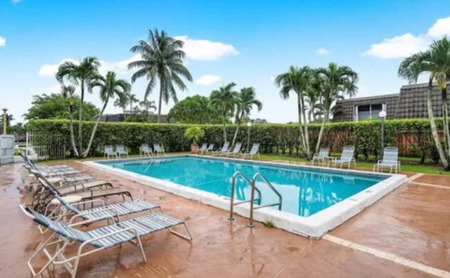 22180 Boca Rancho Dr Unit B, Boca Raton, FL 33428 - community pool featuring a patio
