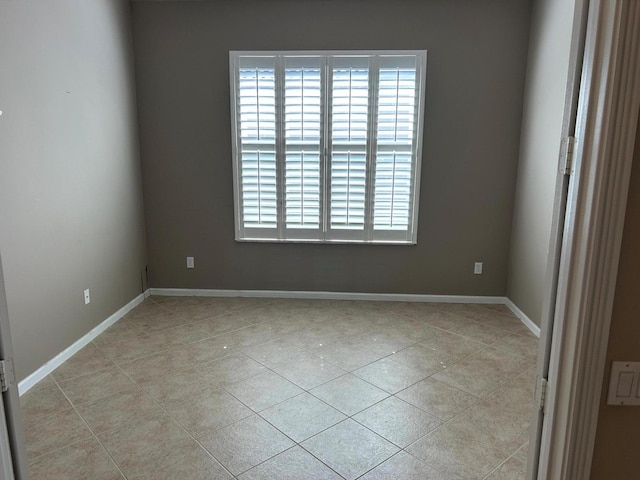 9916 E Tallyrand Dr, Lake Worth, FL 33467 - empty room with light tile patterned floors and baseboards
