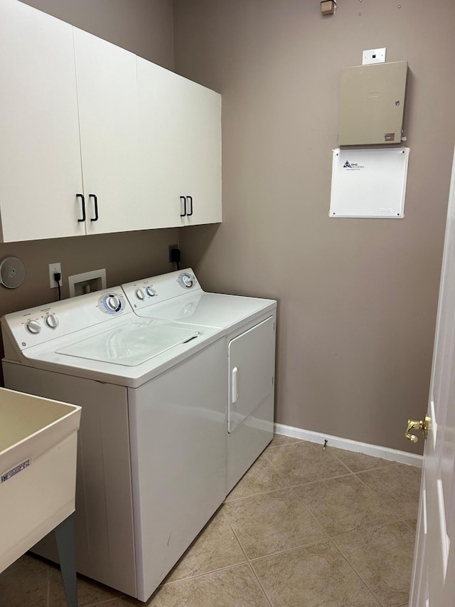 9916 E Tallyrand Dr, Lake Worth, FL 33467 - laundry room with washing machine and clothes dryer, cabinet space, and light tile patterned floors