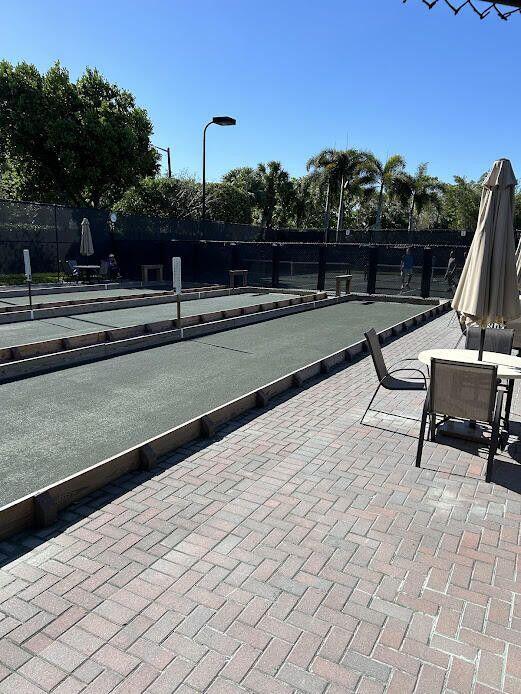 9916 E Tallyrand Dr, Lake Worth, FL 33467 - view of tennis court with a game area