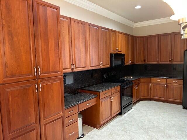 9916 E Tallyrand Dr, Lake Worth, FL 33467 - kitchen featuring black appliances, ornamental molding, brown cabinets, decorative backsplash, and dark stone counters