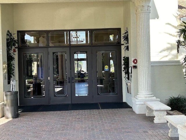 9916 E Tallyrand Dr, Lake Worth, FL 33467 - doorway to property featuring french doors and stucco siding