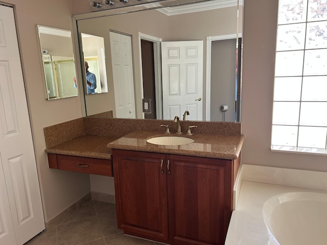 9916 E Tallyrand Dr, Lake Worth, FL 33467 - full bathroom featuring vanity, crown molding, tile patterned floors, and a tub