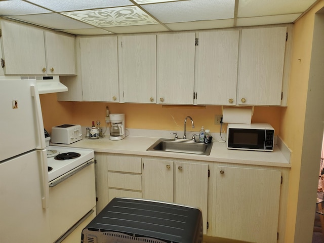 2200 Springdale Blvd Unit 306, Palm Springs, FL 33461 - kitchen featuring white appliances, light countertops, a paneled ceiling, and exhaust hood