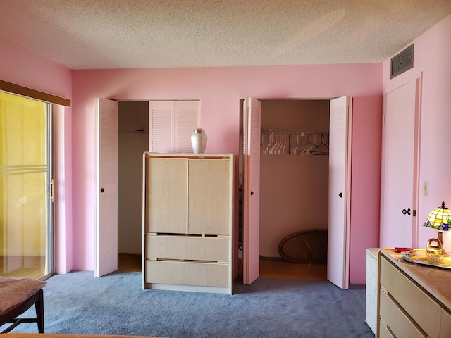 2200 Springdale Blvd Unit 306, Palm Springs, FL 33461 - carpeted bedroom with multiple closets and a textured ceiling
