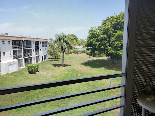 2200 Springdale Blvd Unit 306, Palm Springs, FL 33461 - view of green lawn featuring a balcony