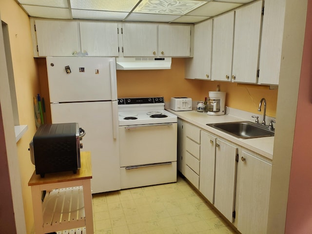 2200 Springdale Blvd Unit 306, Palm Springs, FL 33461 - kitchen featuring white appliances, under cabinet range hood, light floors, and light countertops
