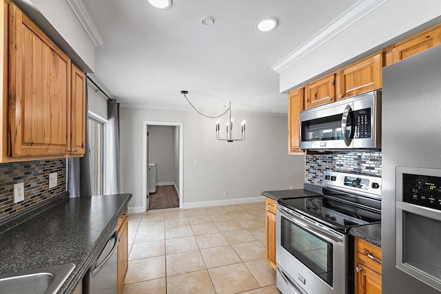 1008 Mohawk St, Jupiter, FL 33458 - kitchen featuring appliances with stainless steel finishes, ornamental molding, decorative backsplash, light tile patterned floors, and brown cabinets