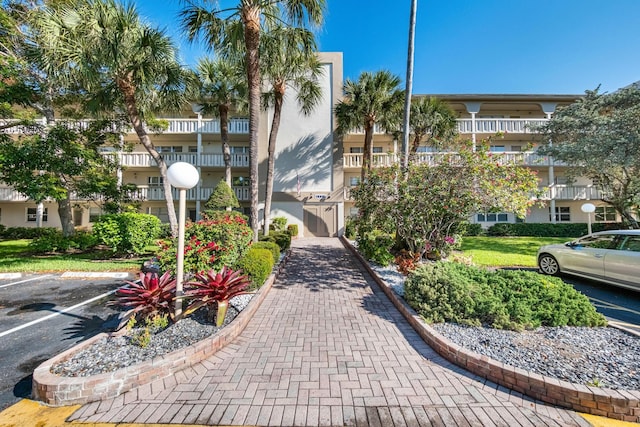 2905 Victoria Pl Unit D3, Coconut Creek, FL 33066 - view of building exterior with uncovered parking