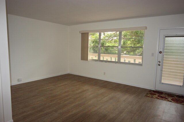 2905 Victoria Pl Unit D3, Coconut Creek, FL 33066 - empty room with dark wood-type flooring and baseboards