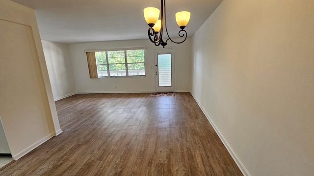 2905 Victoria Pl Unit D3, Coconut Creek, FL 33066 - unfurnished room featuring dark wood-type flooring and a chandelier