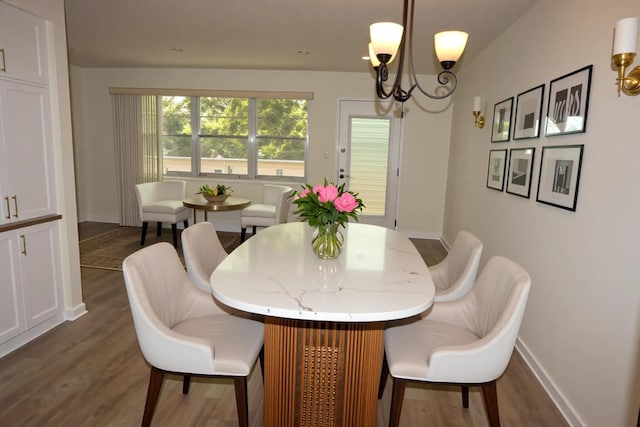 2905 Victoria Pl Unit D3, Coconut Creek, FL 33066 - dining room featuring dark wood finished floors and a chandelier