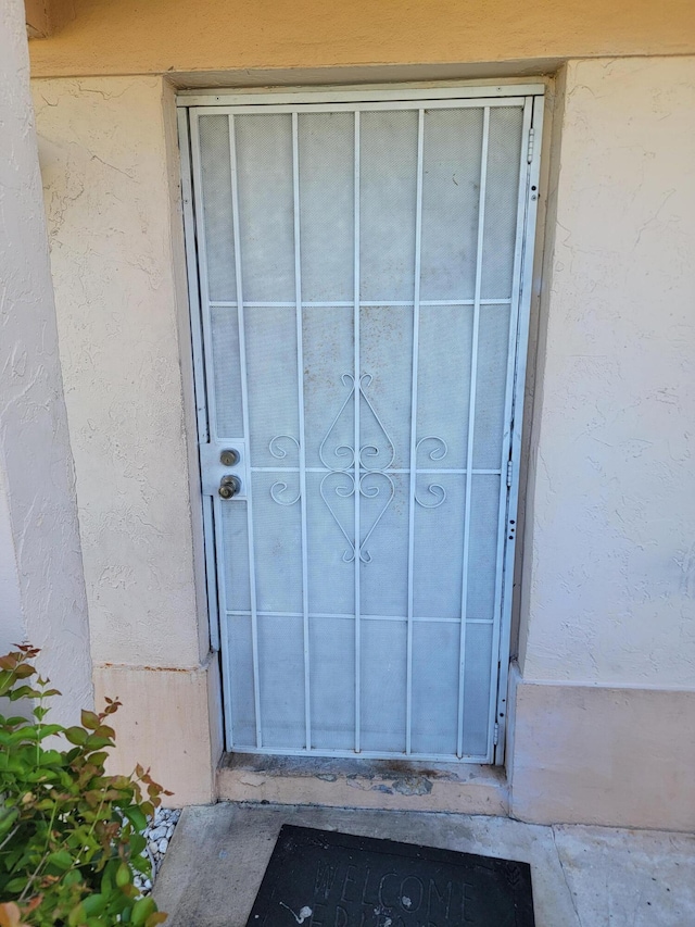 1355 Denlow Ln, Royal Palm Beach, FL 33411 - view of exterior entry featuring stucco siding