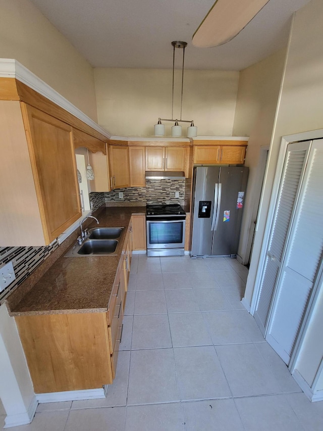 1355 Denlow Ln, Royal Palm Beach, FL 33411 - kitchen featuring appliances with stainless steel finishes, dark countertops, tasteful backsplash, under cabinet range hood, and light tile patterned floors