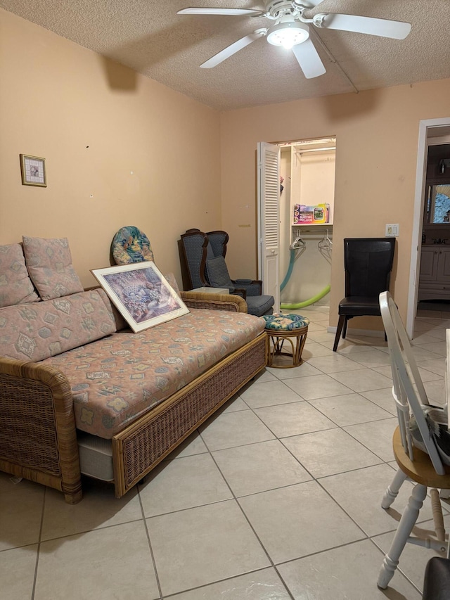 1046 Wolverton C, Boca Raton, FL 33434 - living area with ceiling fan, light tile patterned floors, and a textured ceiling