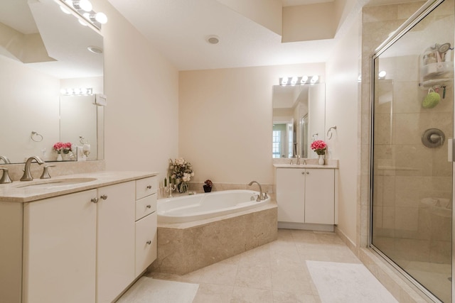 701 S Olive Ave Unit 714, West Palm Beach, FL 33401 - full bath with two vanities, a stall shower, a bath, and tile patterned flooring