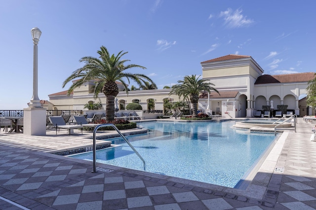 701 S Olive Ave Unit 714, West Palm Beach, FL 33401 - community pool featuring a patio area and a community hot tub
