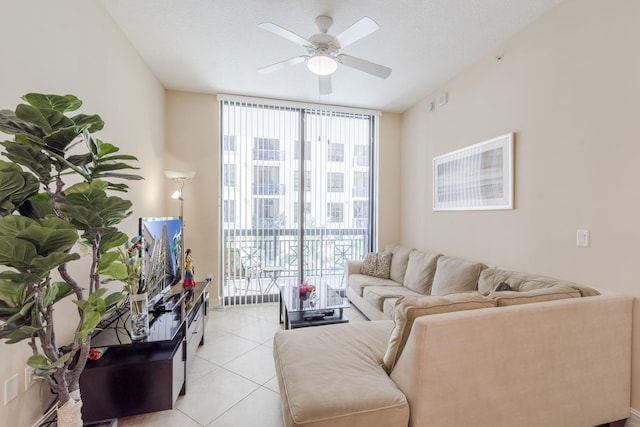 701 S Olive Ave Unit 714, West Palm Beach, FL 33401 - living room featuring floor to ceiling windows, healthy amount of natural light, light tile patterned floors, and a ceiling fan