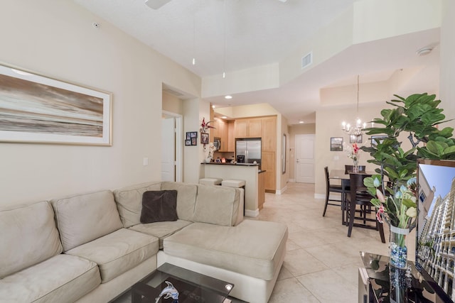 701 S Olive Ave Unit 714, West Palm Beach, FL 33401 - living area with light tile patterned flooring, a chandelier, and ceiling fan