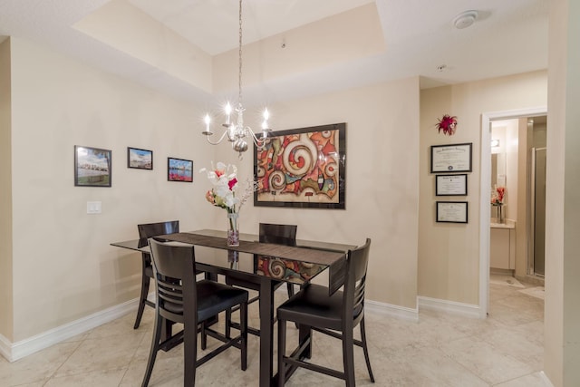 701 S Olive Ave Unit 714, West Palm Beach, FL 33401 - dining space with a chandelier and light tile patterned flooring