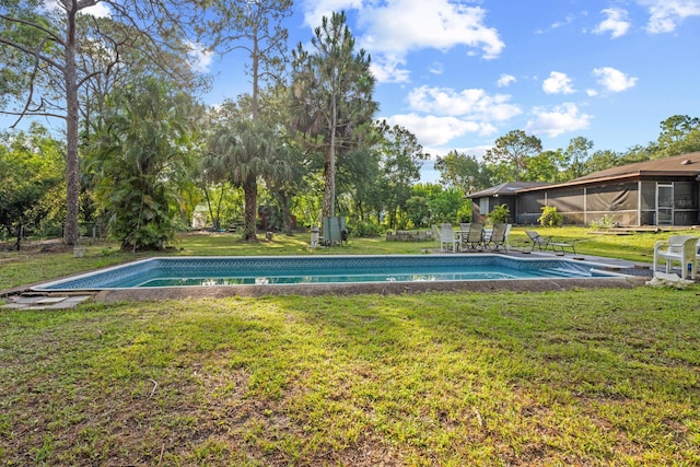 12401 174th Pl N, Jupiter, FL 33478 - swimming pool with a yard and view of scattered trees