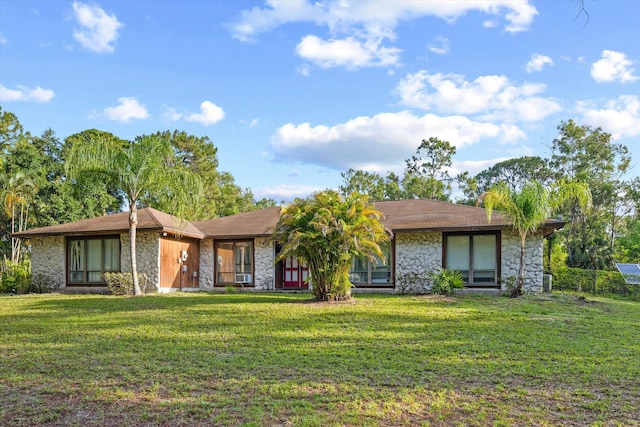 12401 174th Pl N, Jupiter, FL 33478 - view of front of home featuring stone siding and a front lawn