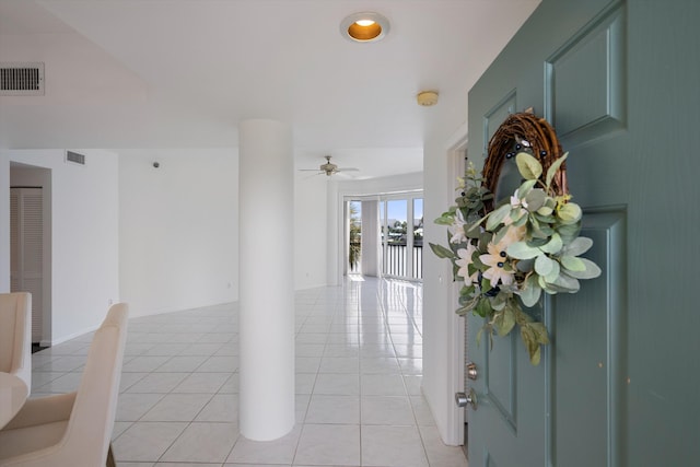 221 NE Plantation Rd Unit 303, Stuart, FL 34996 - foyer entrance with light tile patterned floors, a ceiling fan, and a water view