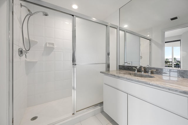 221 NE Plantation Rd Unit 303, Stuart, FL 34996 - full bath featuring a stall shower, vanity, tile patterned flooring, and recessed lighting