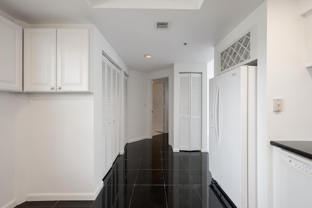 221 NE Plantation Rd Unit 303, Stuart, FL 34996 - kitchen with white appliances, white cabinetry, recessed lighting, and dark countertops