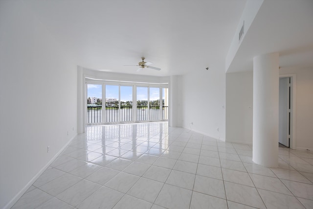 221 NE Plantation Rd Unit 303, Stuart, FL 34996 - empty room featuring light tile patterned flooring, a ceiling fan, and a water view