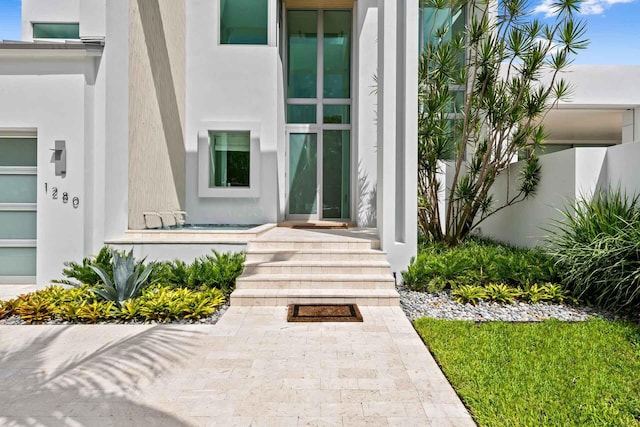 1280 S Ocean Blvd Unit Share A, Delray Beach, FL 33483 - doorway to property with stucco siding