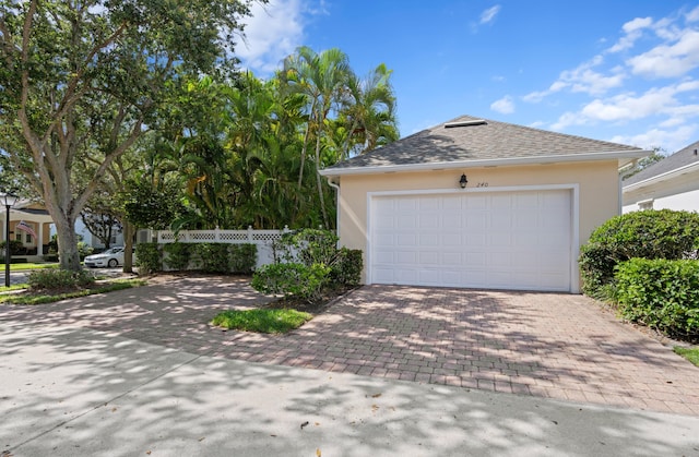 240 Honeysuckle Dr, Jupiter, FL 33458 - garage featuring decorative driveway
