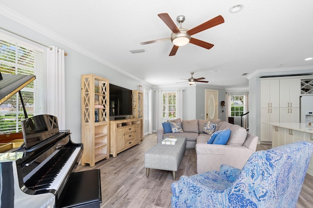 240 Honeysuckle Dr, Jupiter, FL 33458 - living room with ceiling fan, plenty of natural light, light wood-style floors, ornamental molding, and recessed lighting