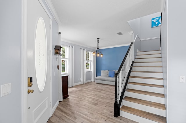 240 Honeysuckle Dr, Jupiter, FL 33458 - foyer entrance featuring crown molding, stairs, and light wood-type flooring