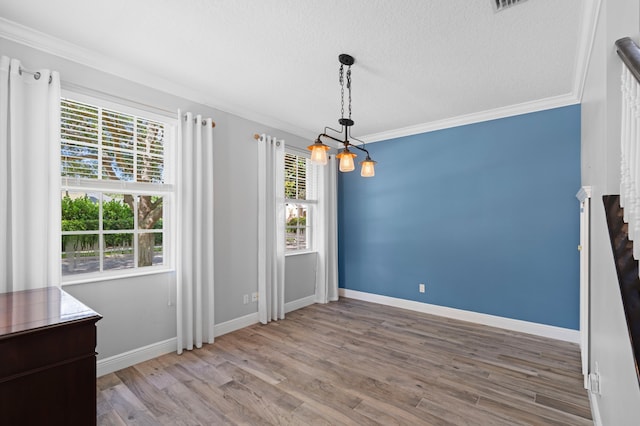 240 Honeysuckle Dr, Jupiter, FL 33458 - unfurnished dining area with crown molding, wood finished floors, a textured ceiling, and stairway