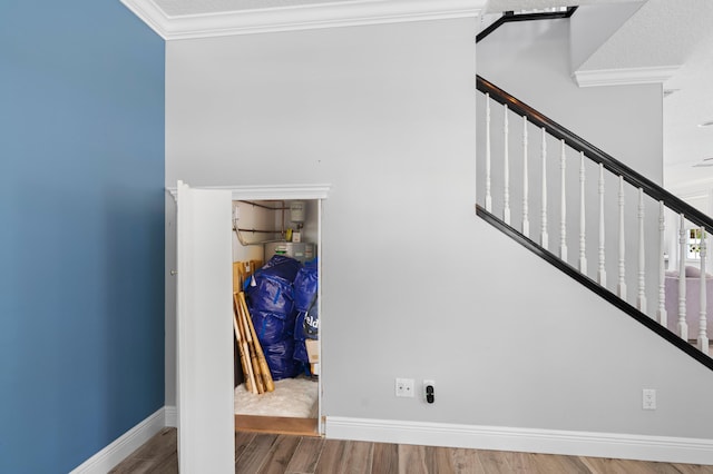 240 Honeysuckle Dr, Jupiter, FL 33458 - stairway featuring crown molding and wood finished floors