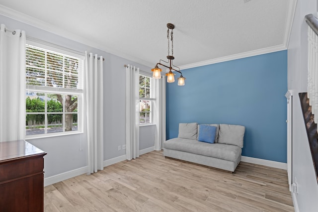 240 Honeysuckle Dr, Jupiter, FL 33458 - sitting room featuring ornamental molding, light wood finished floors, and a textured ceiling