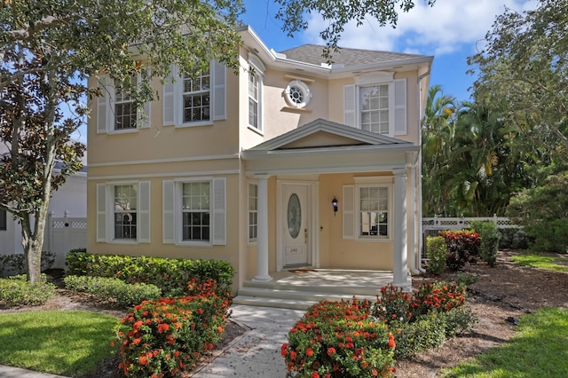 240 Honeysuckle Dr, Jupiter, FL 33458 - view of front facade featuring stucco siding and covered porch